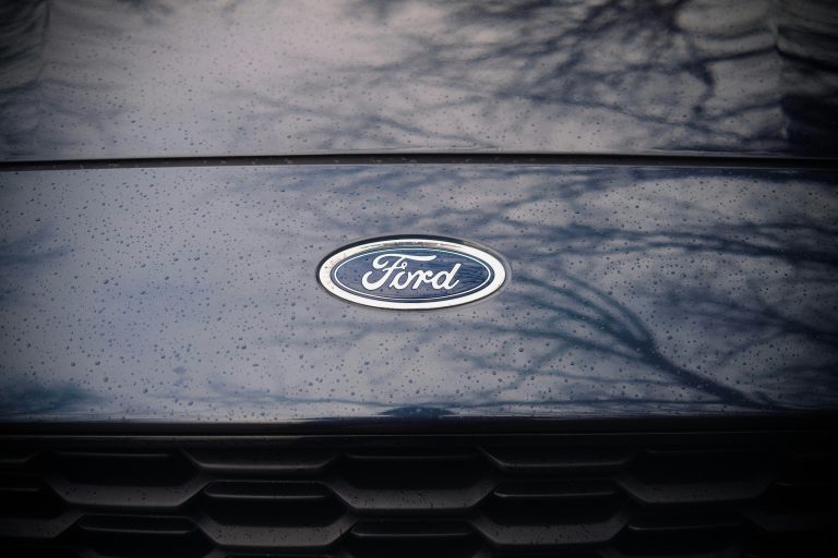 Blue Ford logo on a vehicle grille.