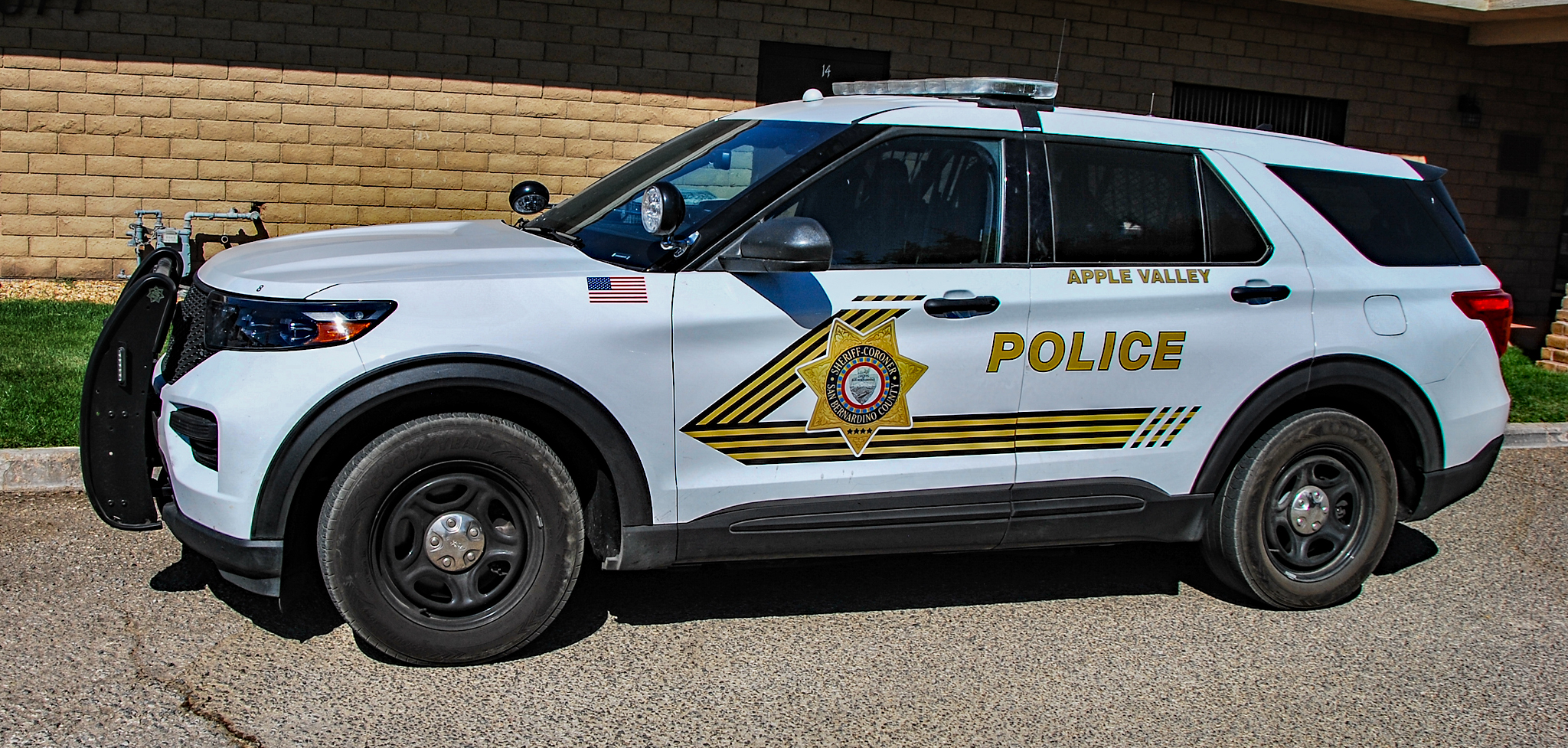 This image shows a white San Bernardino County Sheriff-Coroner car.