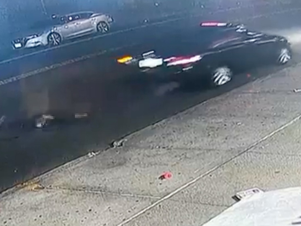 Surveillance footage of a gray vehicle involved in a hit-and-run on Pitkin Avenue in Brooklyn.