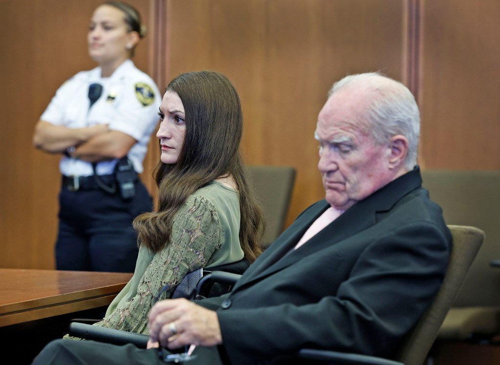 Lindsay-Clancy and her attorney with a officer.