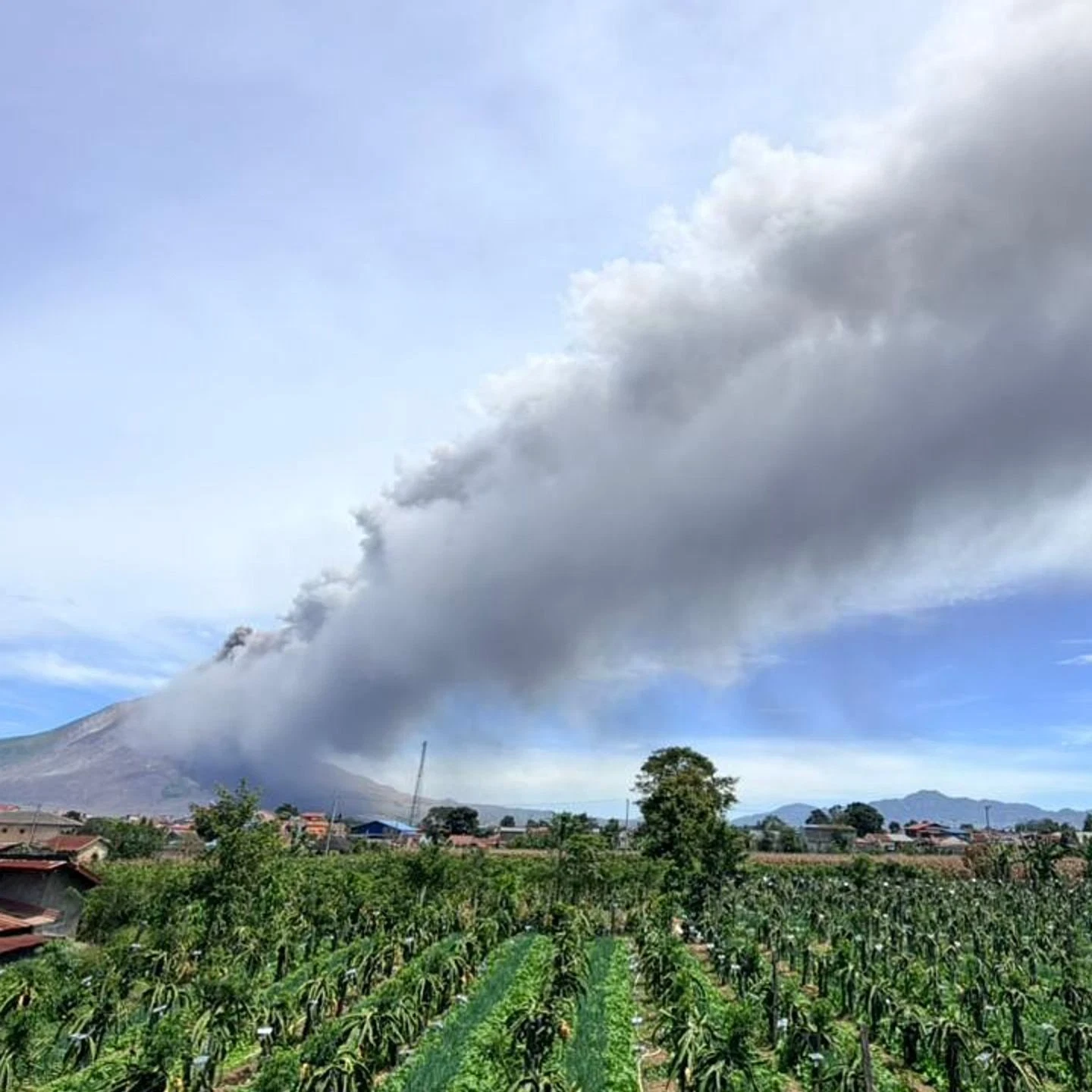 Volcano eruption black smoke, A village.