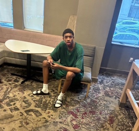 A person wear green t-shirt