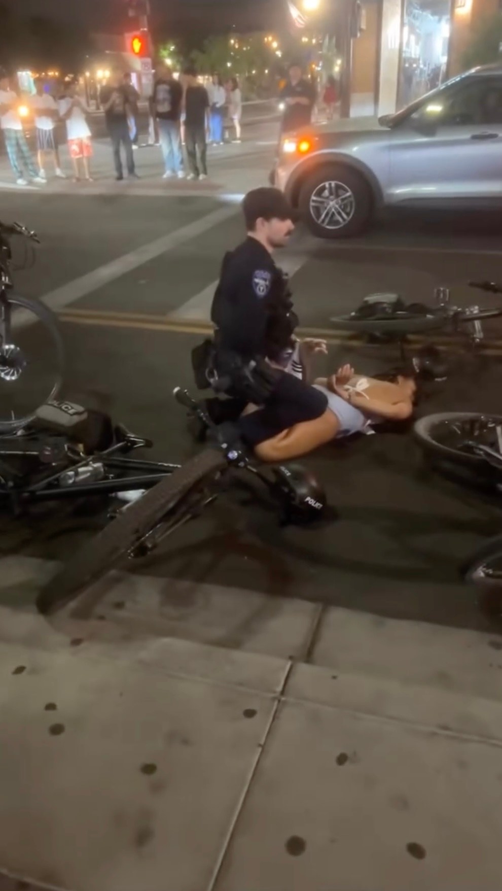 Viral video captures Arizona State cheerleader being shoved to ground, pummeled by cops as she tries to stop arrest